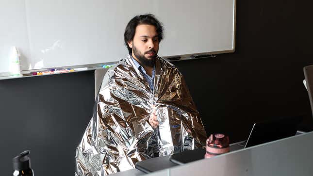 Image for article titled Foil Blanket Draped Over Panting Coworker Who Just Took Stairs