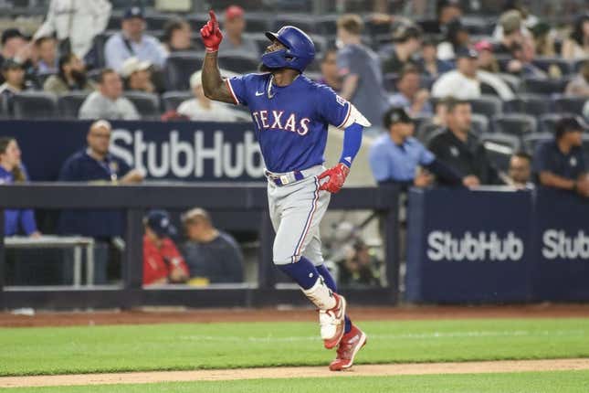 Jun 23, 2023; Bronx, New York, USA;  Texas Rangers right fielder Adolis Garcia (53) gestures after hitting a two run home run in the tenth inning against the New York Yankees at Yankee Stadium.