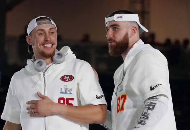 San Francisco 49ers tight end George Kittle (85) greets Kansas City Chiefs tight end Travis Kelce (87) during Super Bowl LIV Opening Night at Marlins Park.Image: Kirby Lee-USA TODAY Sports