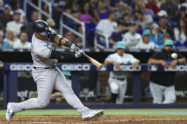 Aug 11, 2023; Miami, Florida, USA; New York Yankees second baseman Gleyber Torres (25) hits a double against the Miami Marlins during the sixth inning at loanDepot Park.