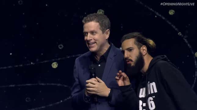 Geoff Keighley and a rogue audience member stand on stage at Games Com Opening Night.