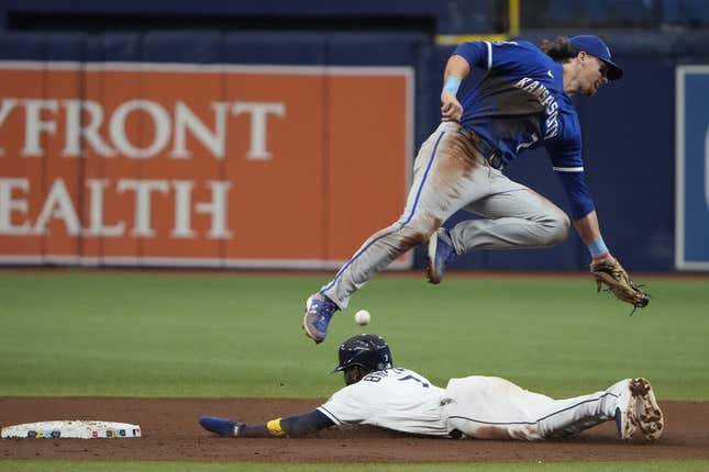 Jun 24, 2023; St. Petersburg, Florida, USA; Tampa Bay Rays right fielder Vidal Brujan (7) steals second base as Kansas City Royals shortstop Bobby Witt Jr. (7) fails to make the catch and tag during the fourth inning at Tropicana Field.