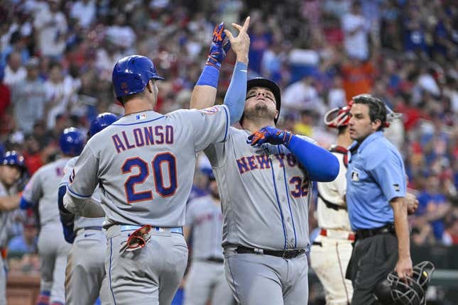 Aug 19, 2023; St. Louis, Missouri, USA;  New York Mets designated hitter Daniel Vogelbach (32) celebrates with first baseman Pete Alonso (20) after hitting a grand slam against the St. Louis Cardinals during the fifth inning at Busch Stadium.