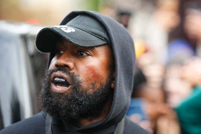 Kanye West aka Ye is seen wearing a Balenciaga boxing mouthguard, outside Givenchy, during Paris Fashion Week - Womenswear Spring/Summer 2023 - Day Seven on October 02, 2022 in Paris, France. 