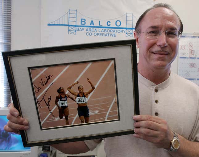 Victor Conte in 2003 poses with an autographed photo of Marion Jones, whom the former BALCO head worked with personally to administer performance-enhancing drugs.