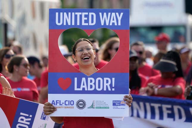 A union member walks in the Labor Day parade in Detroit, Monday, Sept. 4, 2023. (AP Photo/Paul Sancya)
