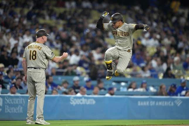 Sep 13, 2023; Los Angeles, California, USA; San Diego Padres left fielder Juan Soto (22) celebrates with third base coach and infield instructor Matt Williams (18) after hitting a home riun in the first inning against the Los Angeles Dodgers at Dodger Stadium.