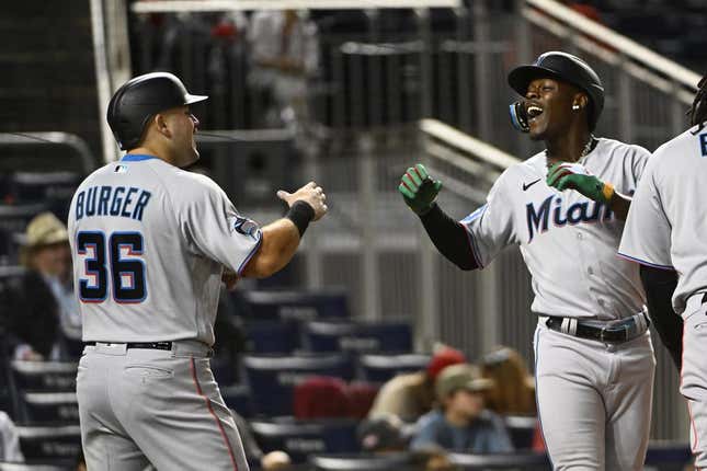 Aug 31, 2023; Washington, District of Columbia, USA; Miami Marlins center fielder Jazz Chisholm Jr. (2) celebrates with third baseman Jake Burger (36) after hitting a three run home run against the Washington Nationals during the fifth inning  at Nationals Park.