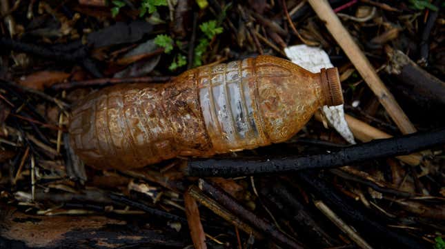 A plastic water bottle is seen washed up on the banks of the Anacostia River on March 21, 2019 in Washington, DC.