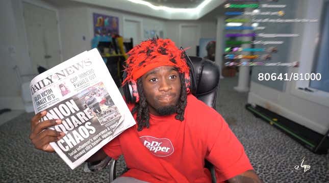 Kai Cenat holds up a copy of The Daily News while on stream.