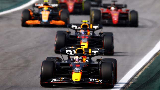A photo of Max Verstappen driving his Red Bull f1 car in Brazil. 