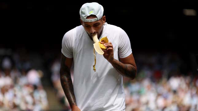 LONDON, ENGLAND - JULY 10: Nick Kyrgios of Australia eats a banana against Novak Djokovic of Serbia during their Men's Singles Final match on day fourteen of The Championships Wimbledon 2022 at All England Lawn Tennis and Croquet Club on July 10, 2022 in London, England. (Photo by Ryan Pierse/Getty Images)