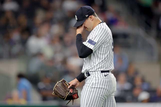 Aug 22, 2023; Bronx, New York, USA; New York Yankees relief pitcher Tommy Kahnle (41) reacts during the eighth inning against the Washington Nationals at Yankee Stadium.
