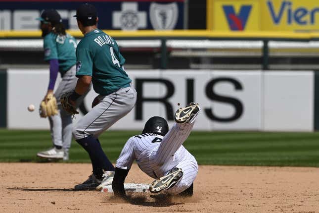 Aug 23, 2023; Chicago, Illinois, USA;  Chicago White Sox center fielder Trayce Thompson (43) slides into second base after hitting a double as Seattle Mariners  second baseman Josh Rojas (4) catches the ball during the fourth inning at Guaranteed Rate Field.