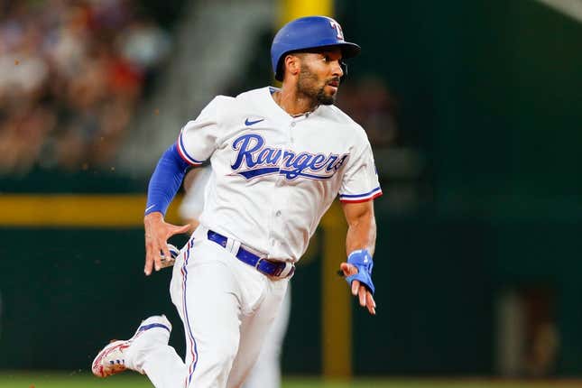 Aug 2, 2023; Arlington, Texas, USA; Texas Rangers second baseman Marcus Semien (2) heads to third base during the second inning against the Chicago White Sox at Globe Life Field.