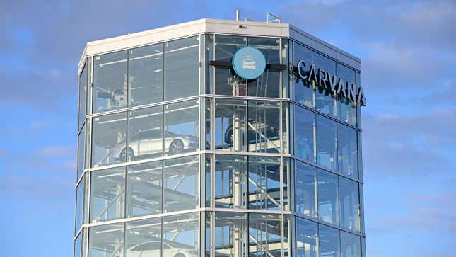 A photo of a glass Carvana tower full of cars. 