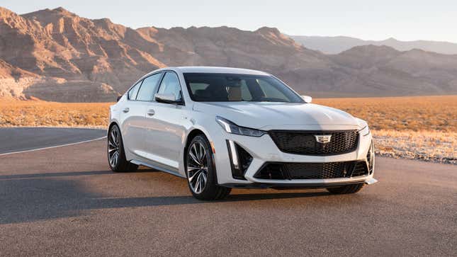 A pearl white 2023 Cadillac CT5-V Blackwing is parked in the desert