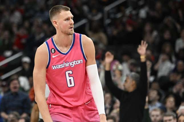 Mar 28, 2023; Washington, District of Columbia, USA; Washington Wizards center Kristaps Porzingis (6) reacts after a basket against the Boston Celtics during the second half at Capital One Arena.