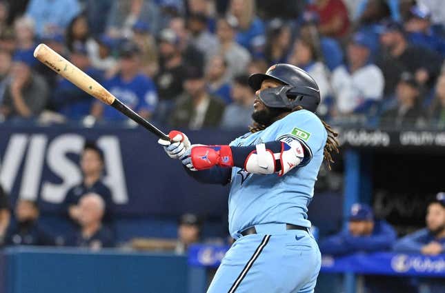 Sep 14, 2023; Toronto, Ontario, CAN;   Toronto Blue Jays first baseman Vladimir Guerrero Jr. (27) hits a two run home run against the Texas Rangers in the first inning at Rogers Centre.