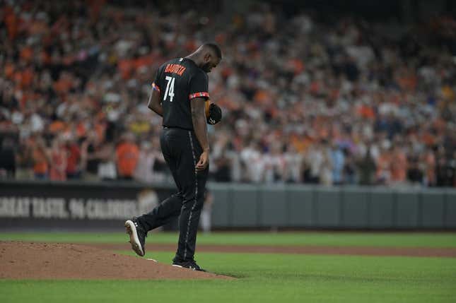 Aug 25, 2023; Baltimore, Maryland, USA;  Baltimore Orioles relief pitcher Felix Bautista (74) walks off the pitcher&#39;s mound after slipping while throwing a ninth inning pitch against the Colorado Rockies at Oriole Park at Camden Yards.