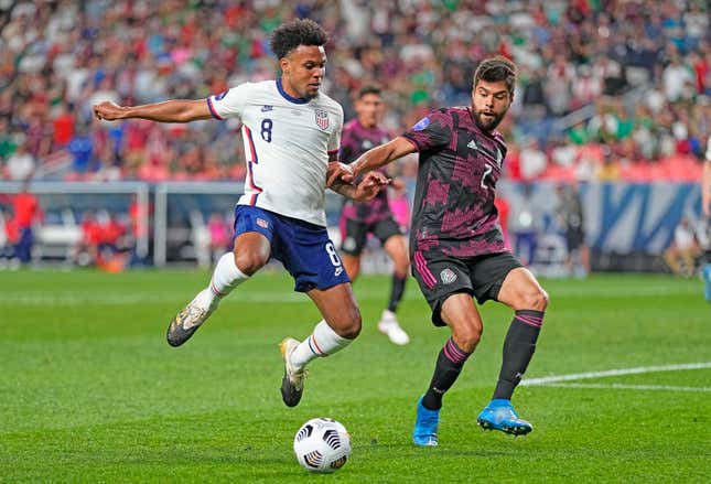United States’ Weston McKennie (8) goes after a ball with Mexico’s Néstor Araujo (2) during the second half of a CONCACAF Nations League championship Sunday.
