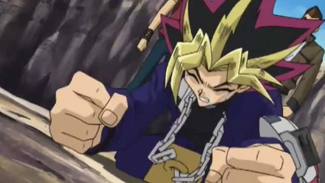 A Yu-Gi-Oh! Duel Monsters anime screenshot of Atem slamming his fists to the ground in rage.