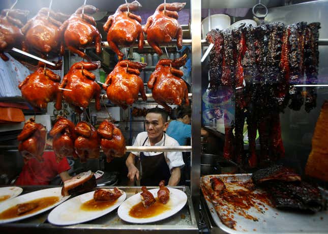 Hawker selling food in Singapore
