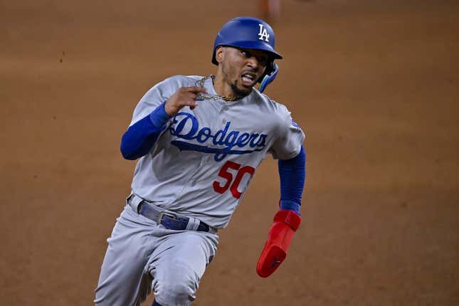Jul 21, 2023; Arlington, Texas, USA; Los Angeles Dodgers right fielder Mookie Betts (50) scores against the Texas Rangers during the eighth inning at Globe Life Field.