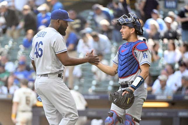 May 10, 2023; Milwaukee, Wisconsin, USA; Los Angeles Dodgers relief pitcher Wander Suero (46) and Los Angeles Dodgers catcher Austin Barnes (15) celebrate a win over the Milwaukee Brewers at American Family Field.