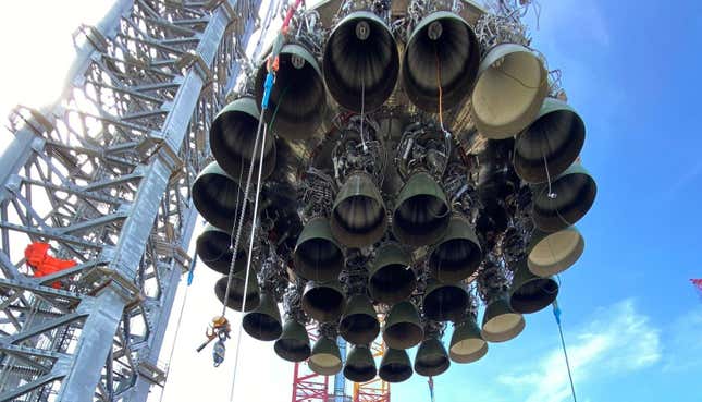 The Super Heavy booster—and its 29 Raptor engines—being lowered to the orbital launch pad.