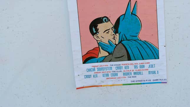 A poster portraying Batman kissing Superman
