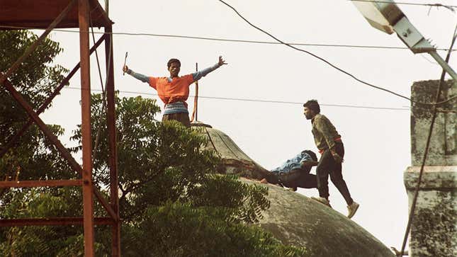 Kar sevaks attack Babri Masjid in Ayodhya on Dec. 6, 1992.
