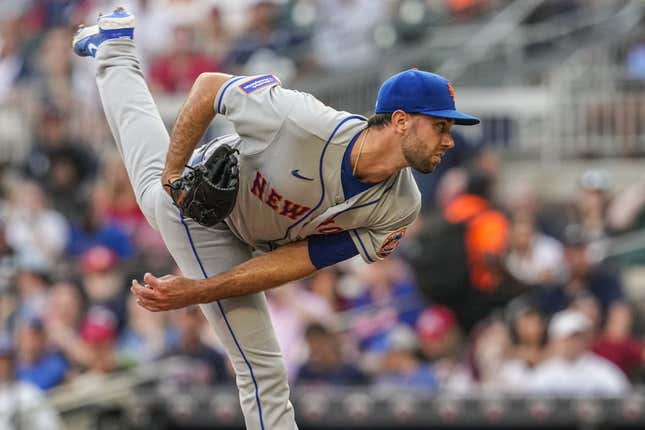 Aug 21, 2023; Cumberland, Georgia, USA; New York Mets starting pitcher David Peterson (23) pitches against the Atlanta Braves during the first inning at Truist Park.