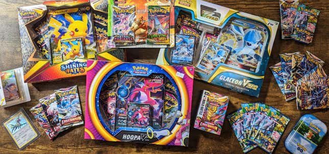 A large collection of various boxes and packs of Pokemon TCG cards.