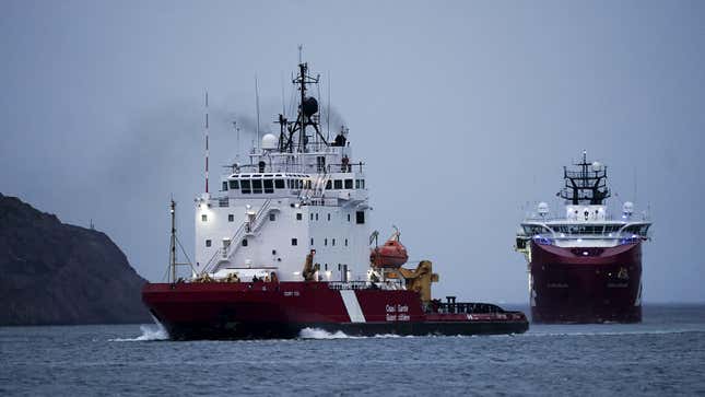 A photo of two research ships joining the search for the Titan.