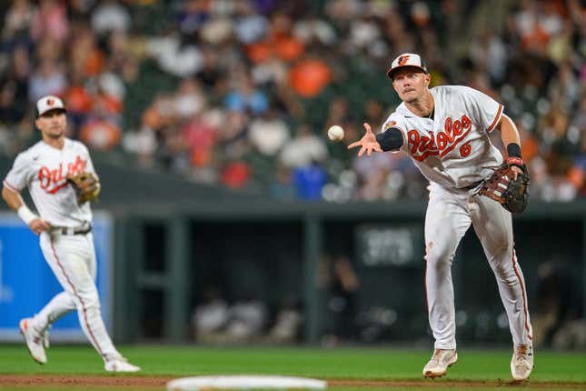 Aug 29, 2023; Baltimore, Maryland, USA; Baltimore Orioles first baseman Ryan Mountcastle (6) tosses the ball to Baltimore Orioles starting pitcher Dean Kremer (not shown) against the Chicago White Sox during the fifth inning at Oriole Park at Camden Yards.