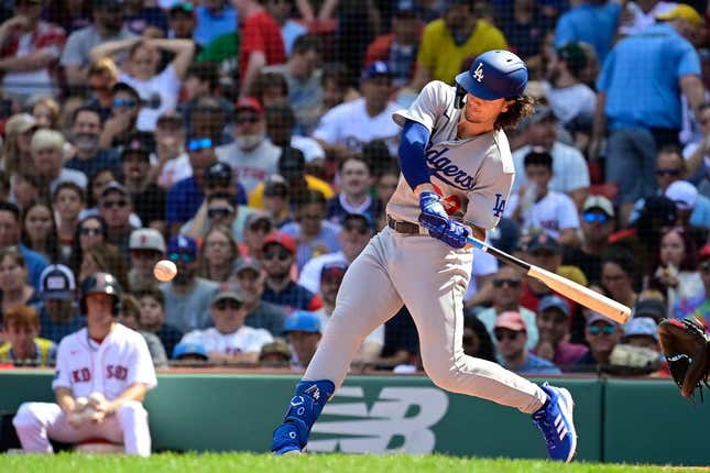 Aug 27, 2023; Boston, Massachusetts, USA; Los Angeles Dodgers center fielder James Outman (33) hits a home run during the fourth inning against the Boston Red Sox at Fenway Park.