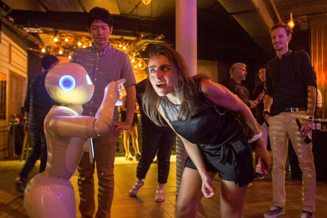 Pepper interacts with guests at the Dentsu party during the Spikes Asia Festival of Creativity on September 10, 2015 in Singapore.