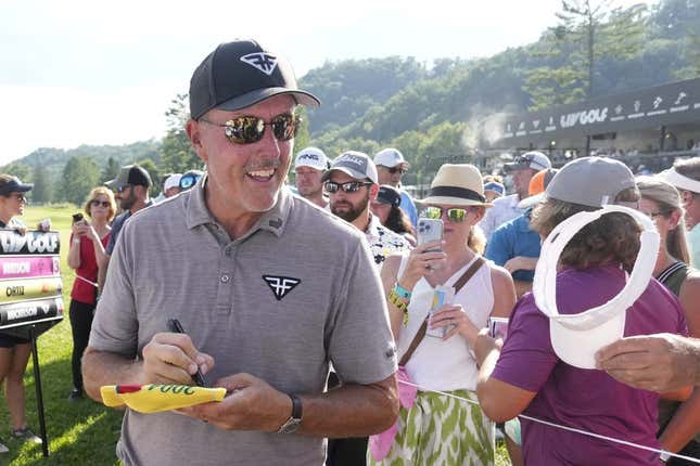 Aug 4, 2023; White Sulphur Springs, West Virginia, USA; Phil Mickelson signs autographs after the first round of the LIV Golf event at The Old White Course.