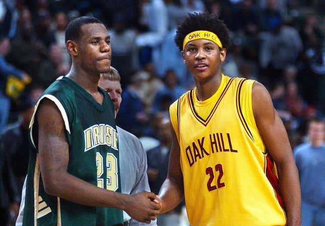 After 19 seasons, Carmelo Anthony retired from the NBA on Monday. Pictured here as a senior at Oak Hill with high school junior LeBron James.