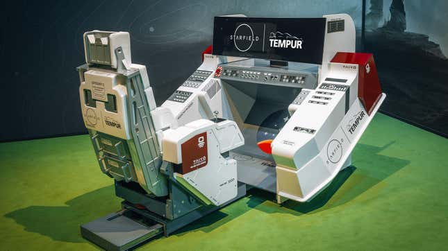 A Tempur 'Dream Chair' setup including a large curve screen and a swivel chair connected to two twin joysticks.