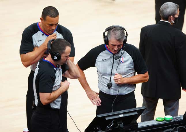 Jun 22, 2021; Phoenix, Arizona, USA; NBA referee Scott Foster (right) with Kane Fitzgerald and Curtis Blair during a video review in the Phoenix Suns against the Los Angeles Clippers during game two of the Western Conference Finals for the 2021 NBA Playoffs at Phoenix Suns Arena.