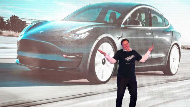 Elon Musk in front of a Tesla in Shanghai. 