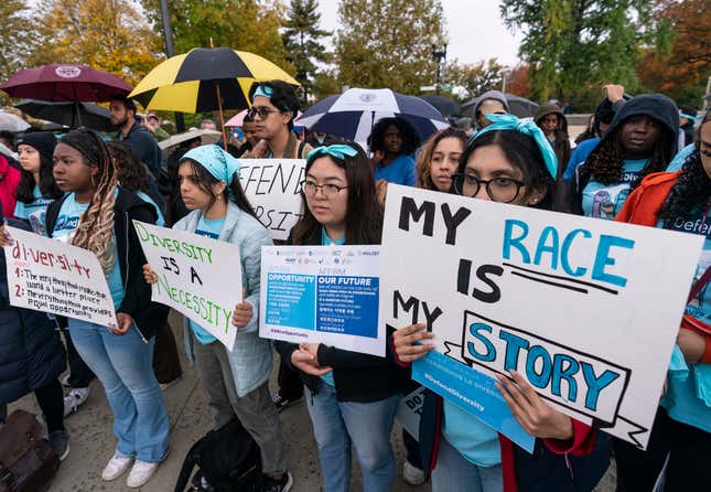 Harvard student, Samaga Pokharel, right, and other activists rally as the Supreme Court hears oral arguments on a pair of cases that could decide the future of affirmative action in college admissions, in Washington, Monday, Oct. 31, 2022.