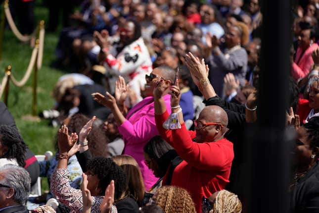 People applaud as Vice President Kamala Harris, accompanied by President Joe Biden and Judge Ketanji Brown Jackson, speaks during an event on the South Lawn of the White House in Washington, Friday, April 8, 2022.