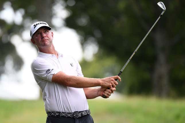 Aug 12, 2023; Memphis, Tennessee, USA; Lucas Glover hits his second shot on the ninth hole during the third round of the FedEx St. Jude Championship golf tournament.