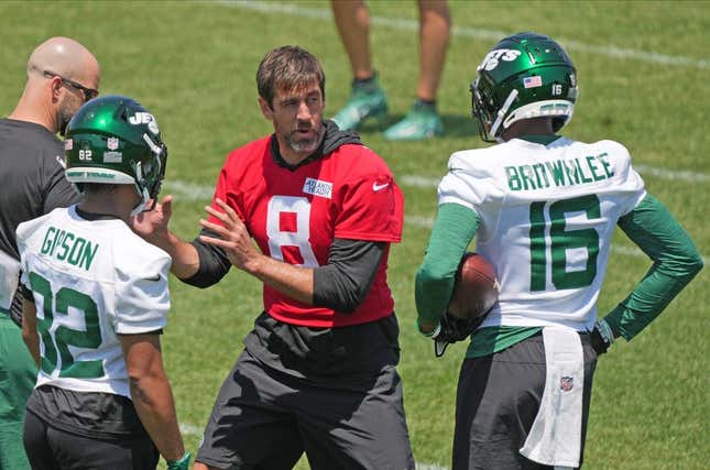 Florham Park, NJ May 31, 2023 -- Aaron Rodgers with Michael Carter and Jason Brownlee during the Jets OTA.