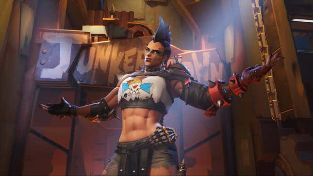 The Junker Queen in Overwatch 2 extends both her arms in front of a Junkertown sign.