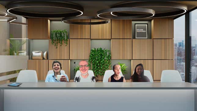 A screenshot of a Zoom call between four Quartz staffers, in which they all appear against one backdrop designed to look like a corporate boardroom. One participant is mostly blurred into the background.