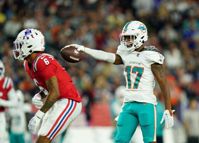Sep 17, 2023; Foxborough, Massachusetts, USA; Miami Dolphins wide receiver Jaylen Waddle (17) reacts after his first down catch against New England Patriots cornerback Christian Gonzalez (6) in the second quarter at Gillette Stadium.